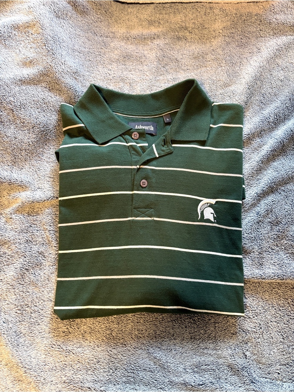 Ashworth MSU Polo. Green with White Stripes and